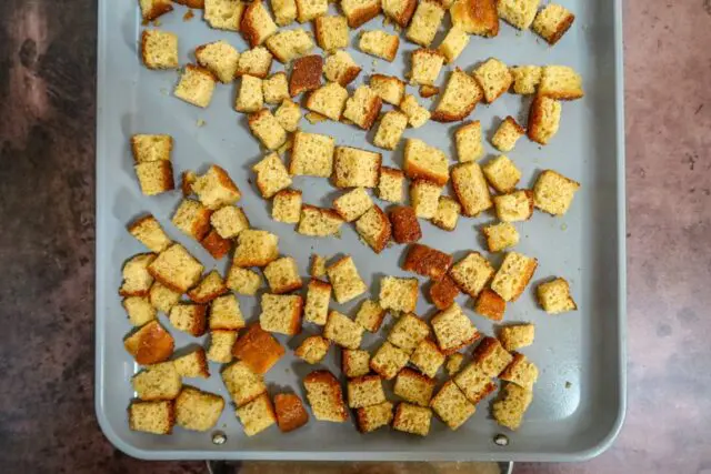 cornbread croutons on a baking sheet