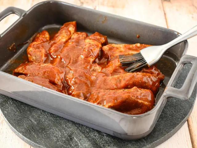 brush the ribs with bbq sauce