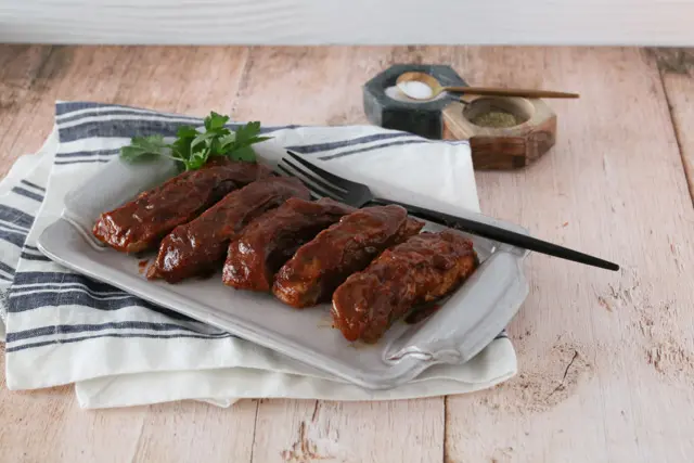 country style ribs with maple bbq sauce on a platter