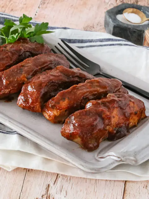 country style ribs with maple bbq sauce on a platter