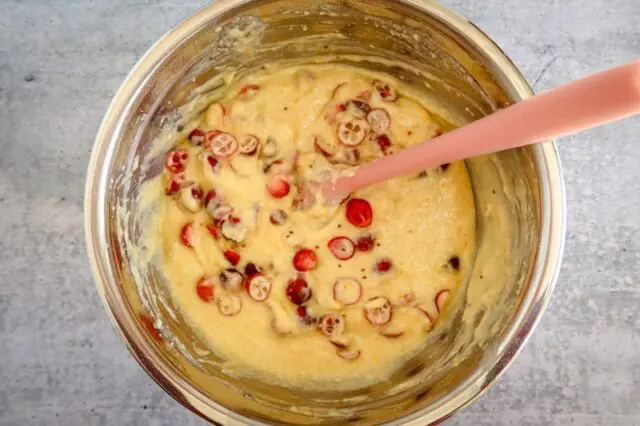 folding cranberries into the batter