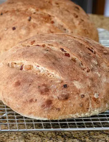 cranberry walnut yeast bread, 2 loaves on a cooling rack