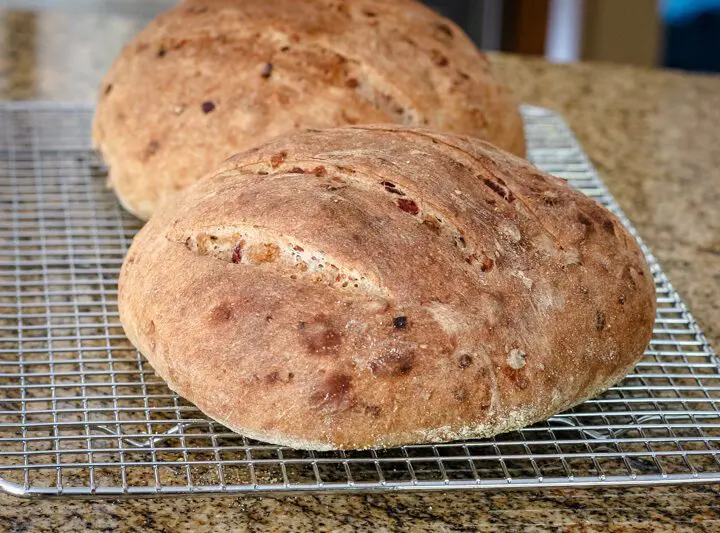 cranberry walnut yeast bread, 2 loaves on a cooling rack