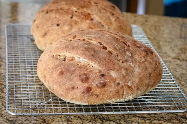 cranberry walnut yeast bread, 2 loaves on a cooling rack