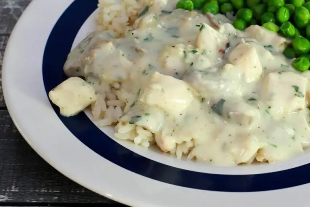 chicken and mushrooms in a creamy sauce on a plate