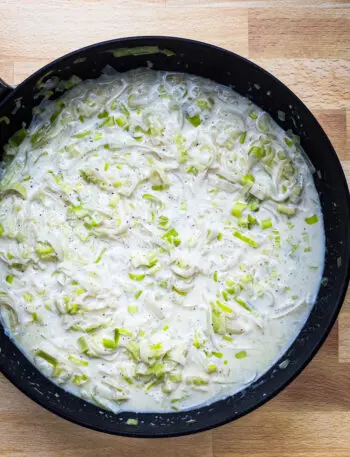 Add the cream and Parmesan cheese to the leeks and add salt and pepper to taste. Time to serve!