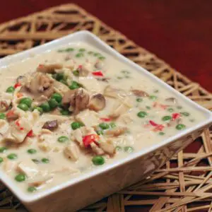 creamed turkey with leftover turkey and vegetables in a serving bowl