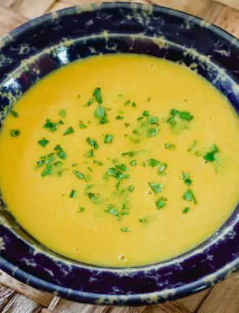 butternut squash soup in a wide pottery bowl