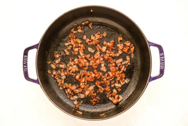 Crisp pancetta in the sauté pan.