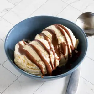 easy keto chocolate sauce drizzled on ice cream