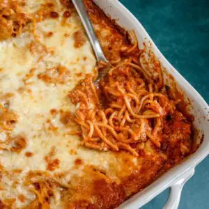 creamy spaghetti casserole with cheese, ground beef, and tomato sauce