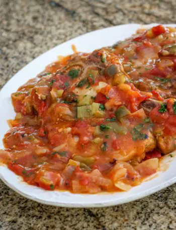 creole pork chops on a platter