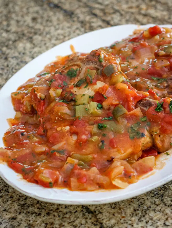 creole pork chops on a platter