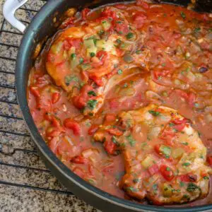 creole pork chops in a pan