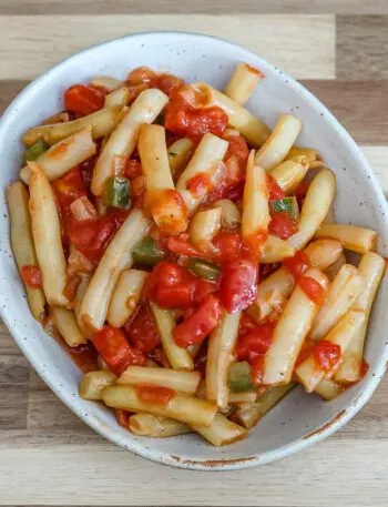 creole-style wax beans with tomatoes in a a small dish