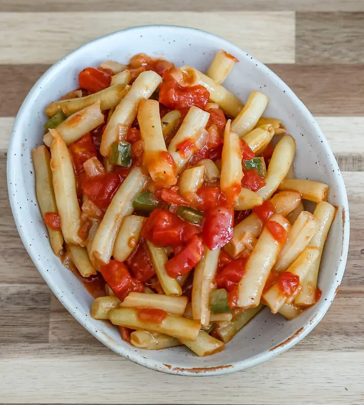 creole-style wax beans with tomatoes in a a small dish