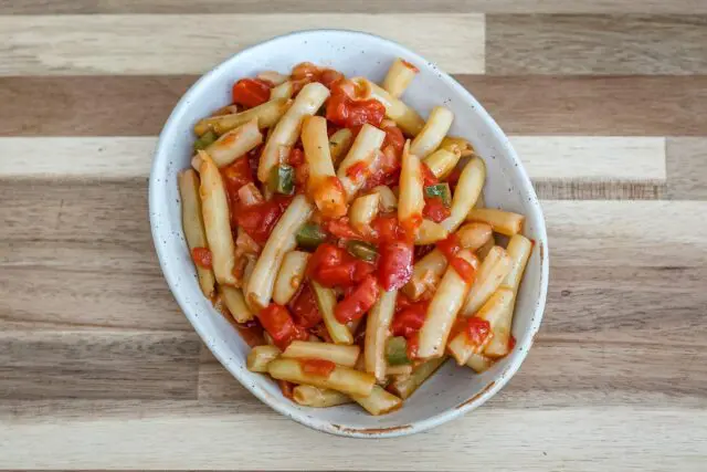 creole-style wax beans with tomatoes in a a small dish