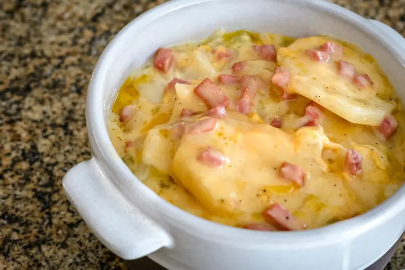 closeup of slow cooker scalloped potatoes with ham