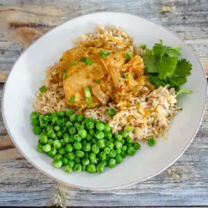 A serving of slow cooker curry chicken with rice