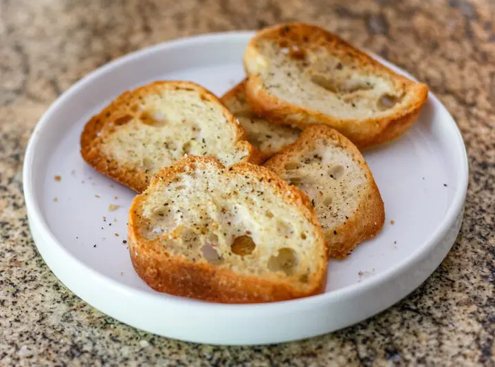 Simple seasoned crostini on a plate