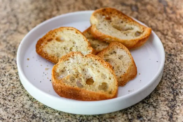 Simple seasoned crostini on a plate