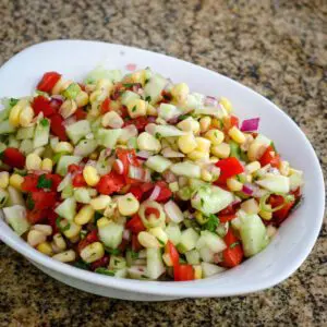 a serving dish with cucumber salsa