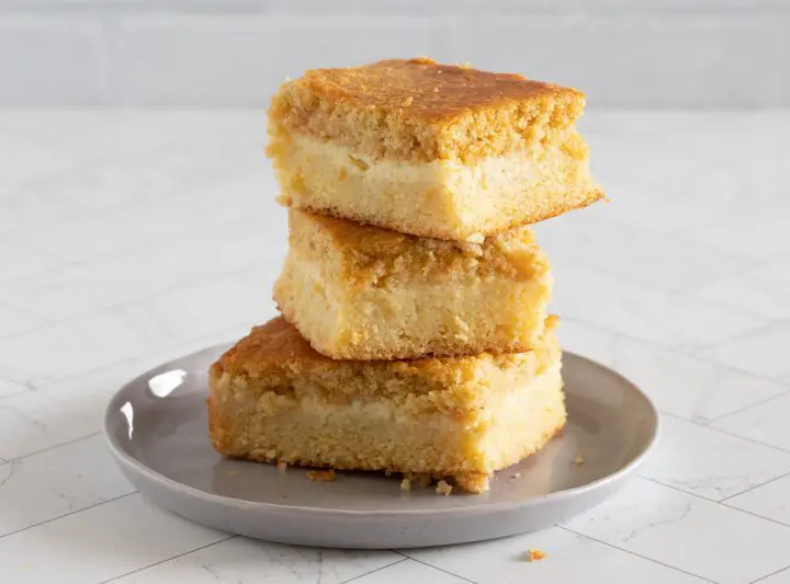 custard cornbread stacked on a plate