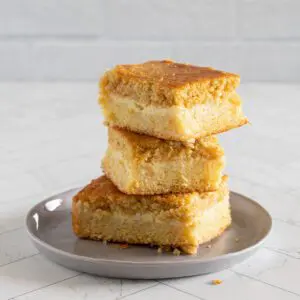 custard cornbread stacked on a small plate