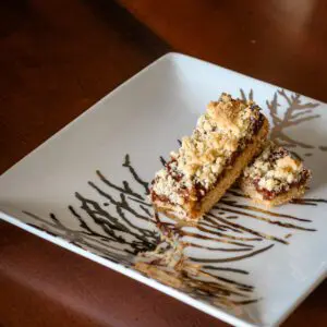 date bars with shortbread crust on a holiday plate