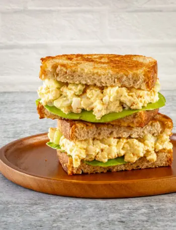 egg salad sandwich on toasted bread with lettuce