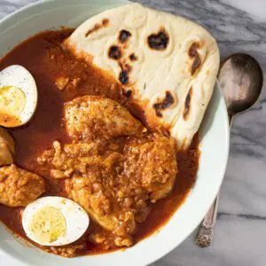 ethiopian dor wat chicken stew with chicken thighs and hard boiled eggs