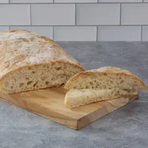 A sliced loaf of ciabatta bread.