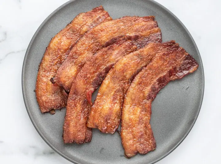 A plate of baked bacon.