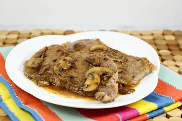 Steak Diane with sauce on a serving platter