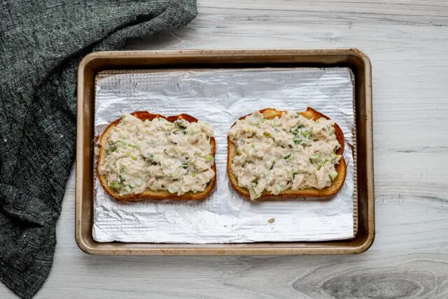 Pile the tuna salad mixture on the toast.