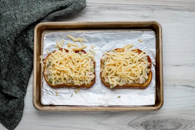 Mound the shredded cheese on the tuna mixture.