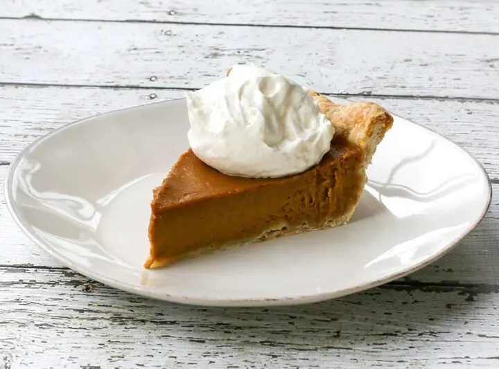 bourbon pumpkin pie with whipped cream