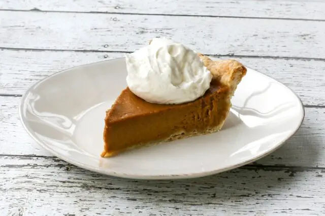 bourbon pumpkin pie with whipped cream