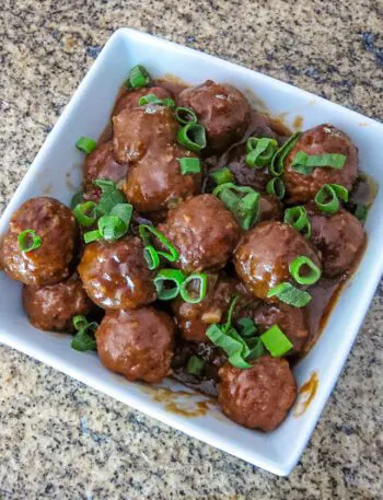 slow cooker meatballs with asian flavors in a serving bowl