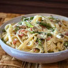 ham and asparagus fettuccine in a bowl