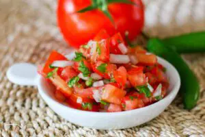 fresh salsa on a small plate (pico de gallo)