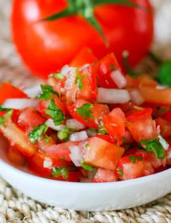 fresh salsa on a small plate (pico de gallo)