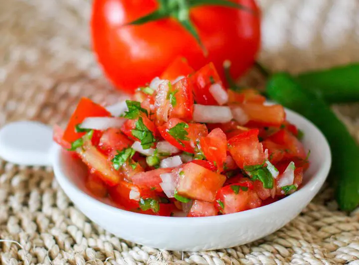 fresh salsa on a small plate (pico de gallo)