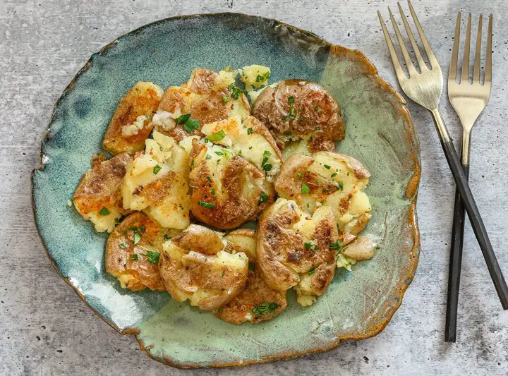 crispy fried smashed potatoes on a plate