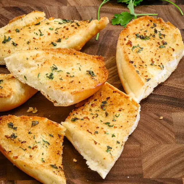 Toasty browned garlic bread made with fresh garlic and parsley.