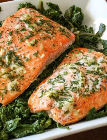 garlic and herb salmon on a bed of spinach