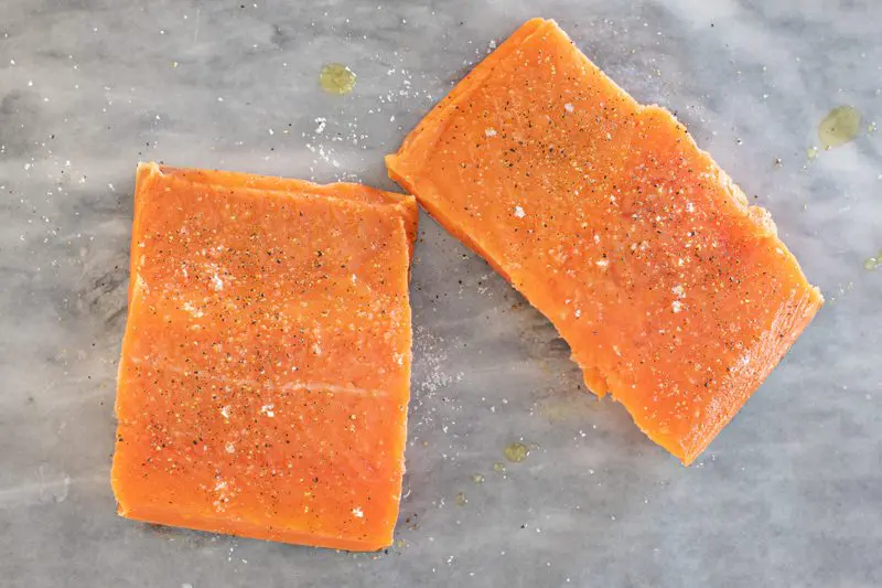 Salmon fillets seasoned with salt and pepper