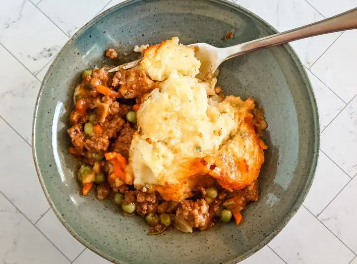 A serving of gluten free cottage pie in a bowl.