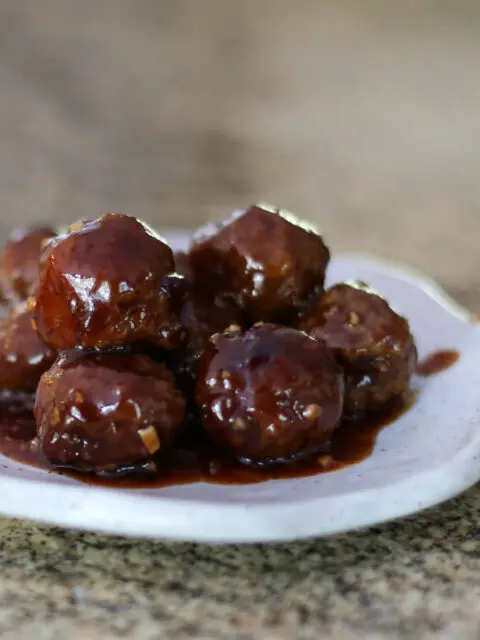 grape jelly meatballs on a plate