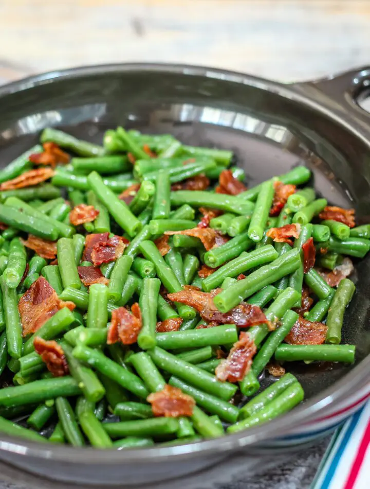 green beans with bacon in in a DVF serving dish